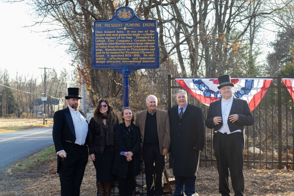 Above from left: “President Grant”, Andria Zaia (NMIH), Erin Kintzer (Lehigh University), Mark Connar, William Lewis (PHMC) and “Lehigh Zinc President Webster” in front of the President Pumping Engine Pennsylvania Historical Marker